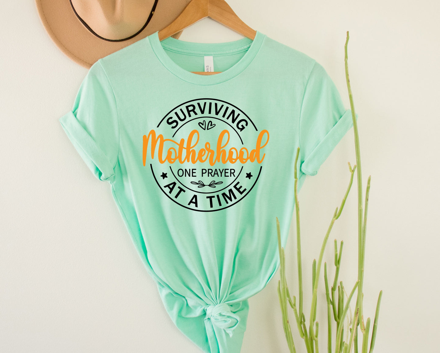 Surviving Motherhood Graphic Tee