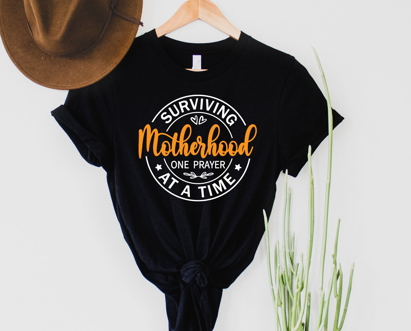Surviving Motherhood Graphic Tee